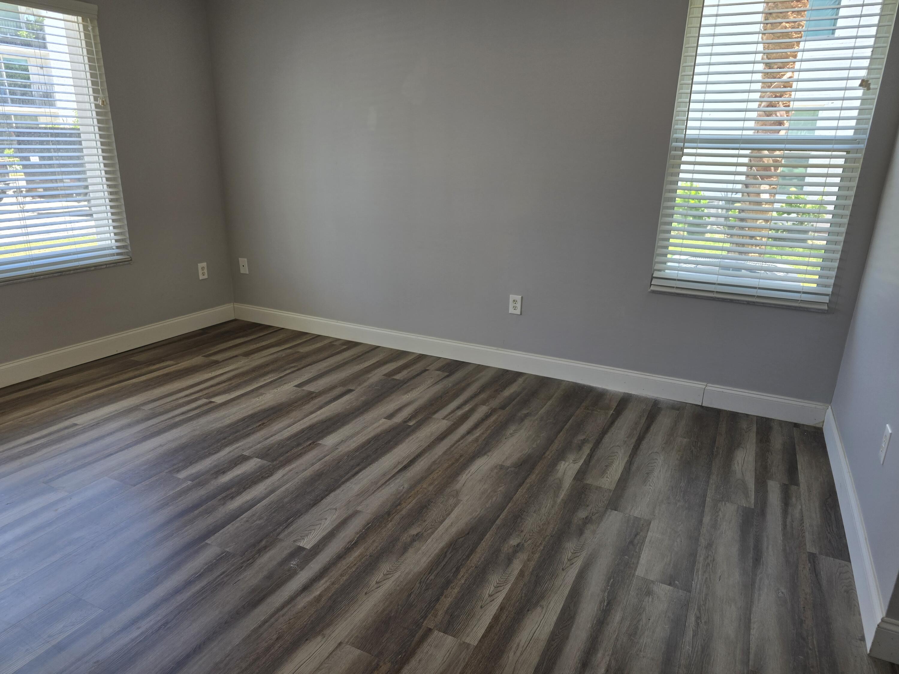 701 Villa Circle Boynton Beach, FL 33435 - Photo 6 of 17 a view of wooden floor and windows in a room