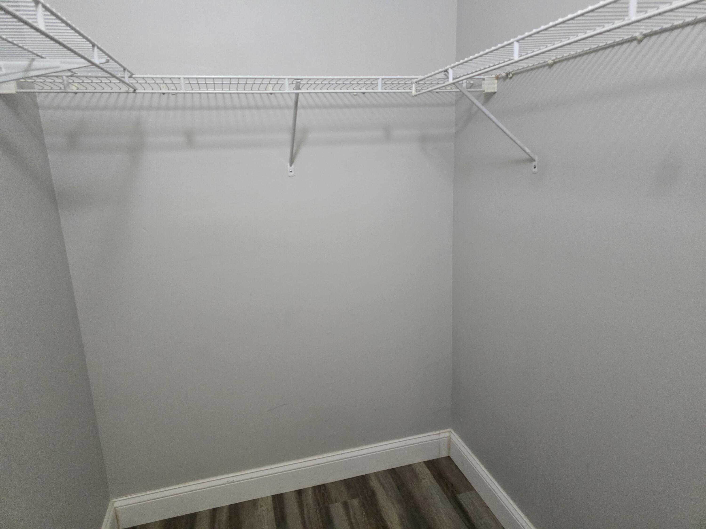 701 Villa Circle Boynton Beach, FL 33435 - Photo 8 of 17 a view of a room with racks on the wall