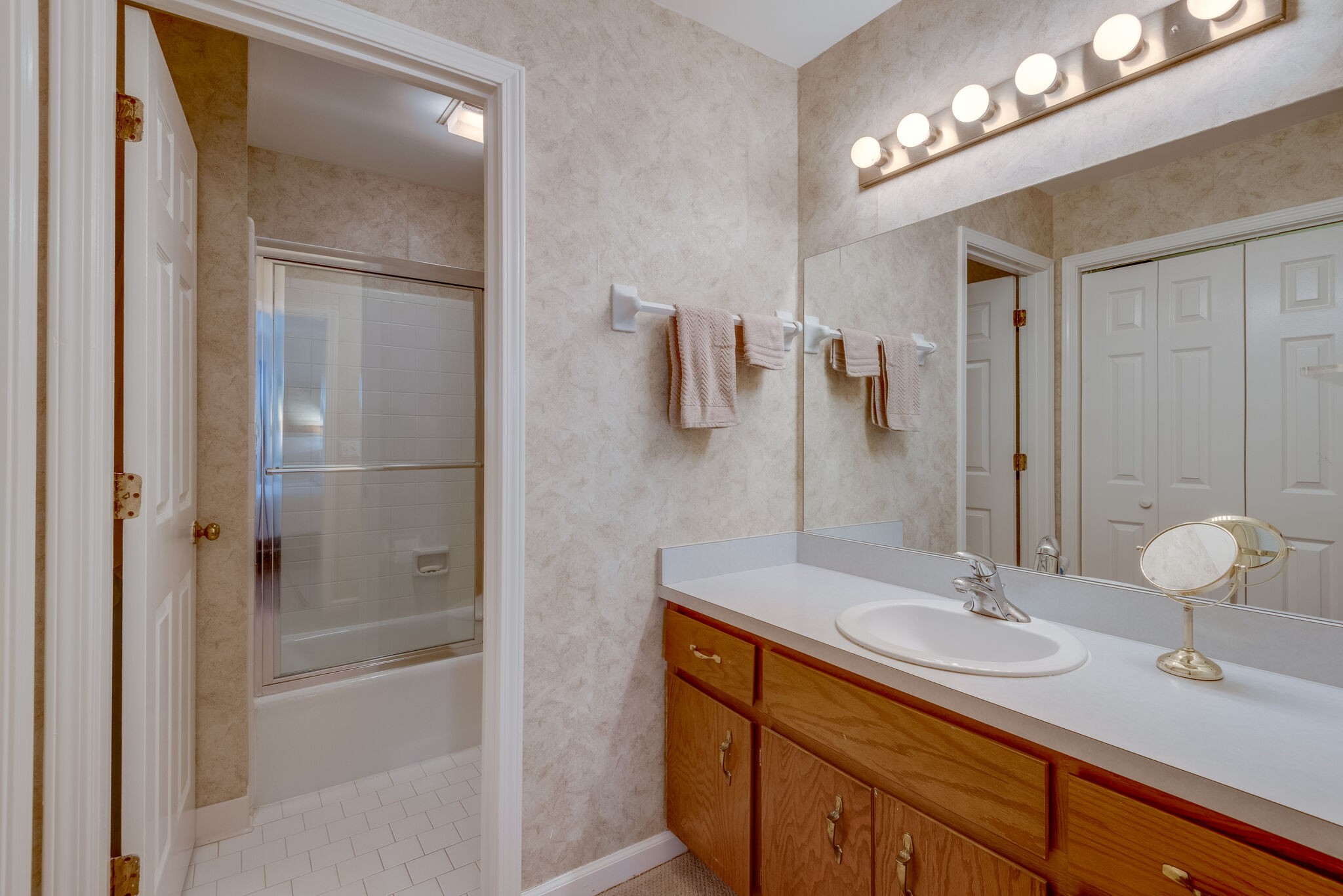 745 Kent Road Nashville, TN 37214 - Photo 17 of 26 a bathroom with a sink double vanity and shower