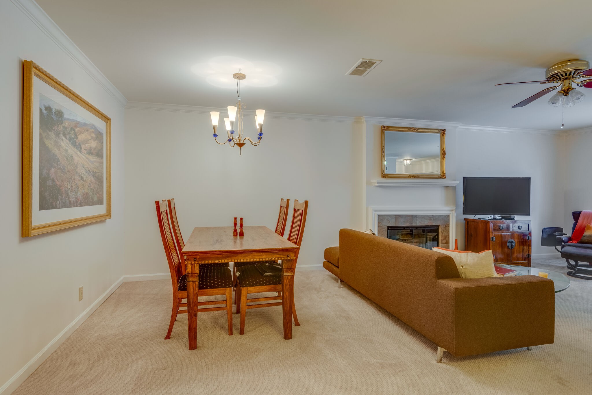 745 Kent Road Nashville, TN 37214 - Photo 7 of 26 a living room with furniture a chandelier and a flat screen tv