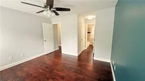 a view of an entryway with wooden floor