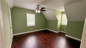 446 Russell Cemetery Road Winder, GA 30680 - Photo 21 of 40 a view of a room with wooden floor and fan