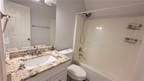 446 Russell Cemetery Road Winder, GA 30680 - Photo 22 of 40 a bathroom with a granite countertop sink toilet and shower