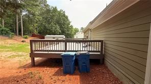 446 Russell Cemetery Road Winder, GA 30680 - Photo 33 of 40 a view of a roof deck with wooden floor and fence