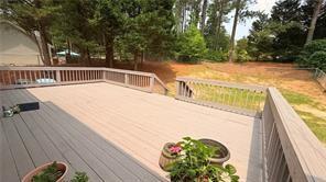 446 Russell Cemetery Road Winder, GA 30680 - Photo 35 of 40 a view of a swimming pool with a patio and a yard