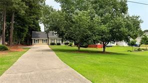 446 Russell Cemetery Road Winder, GA 30680 - Photo 5 of 40 a view of a house with a backyard