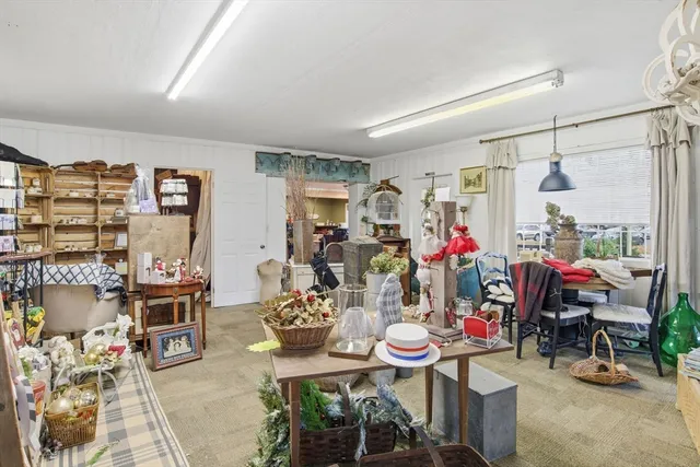 a living room with lots of furniture and a fireplace