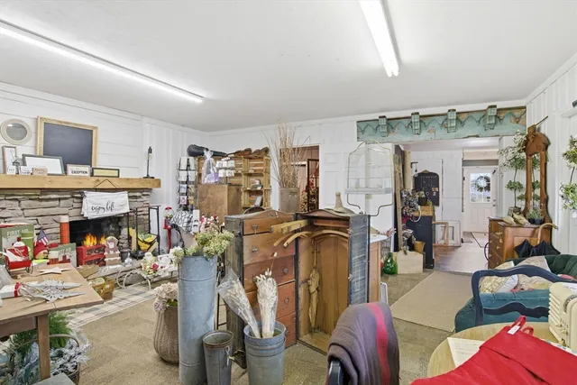 a living room with lots of furniture and a fireplace