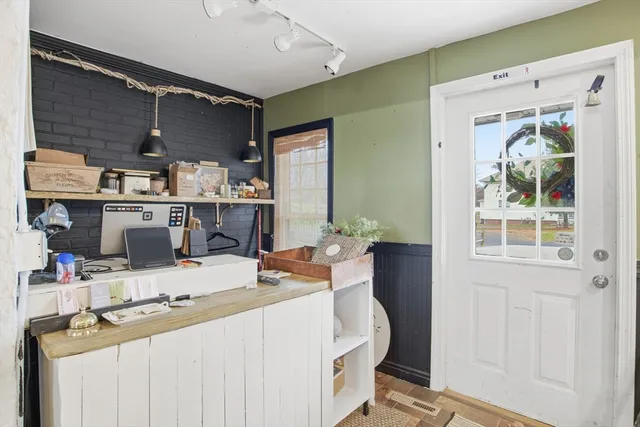 a kitchen with a refrigerator and a stove