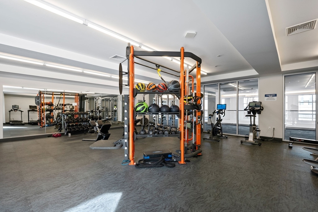 45 West 3rd Street, Unit 406 Boston, MA 02127 - Photo 11 of 14 a view of a garage with gym equipment