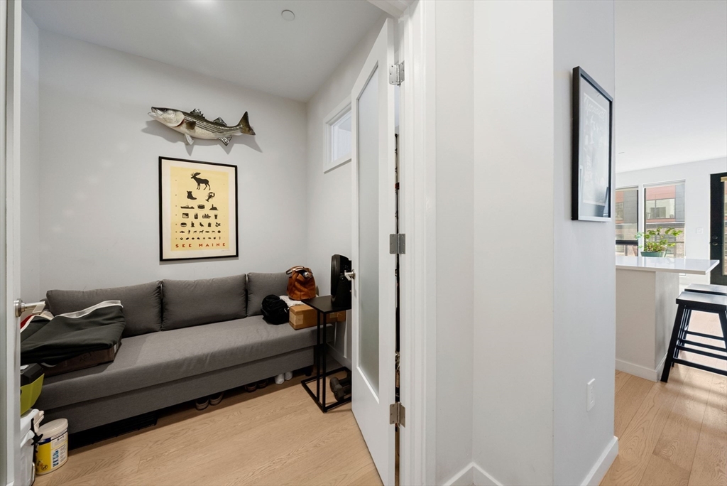 45 West 3rd Street, Unit 406 Boston, MA 02127 - Photo 8 of 14 a living room with furniture and a window