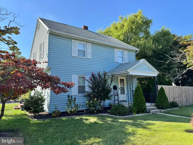 a view of a house with a yard and plants