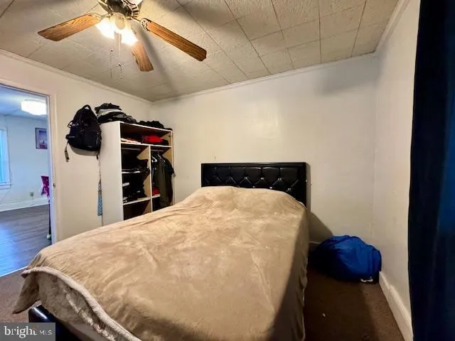 a bed sitting in a bedroom and dressers