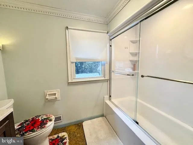 a bathroom with a bathtub and shower