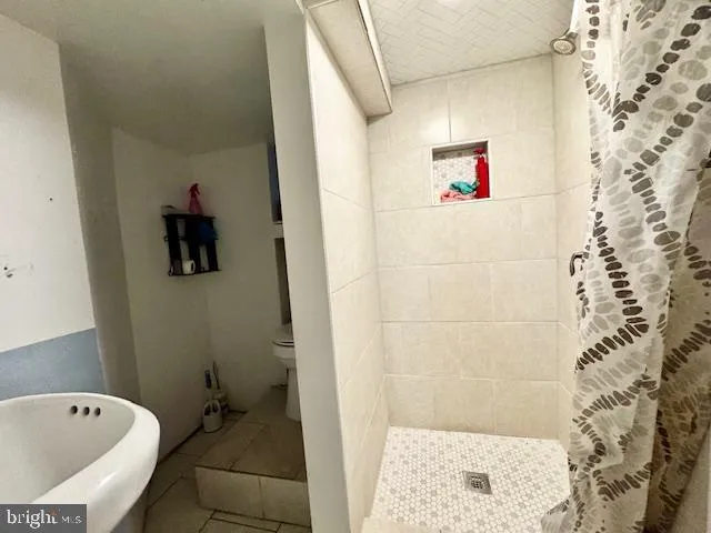 a bathroom with a bathtub and shower