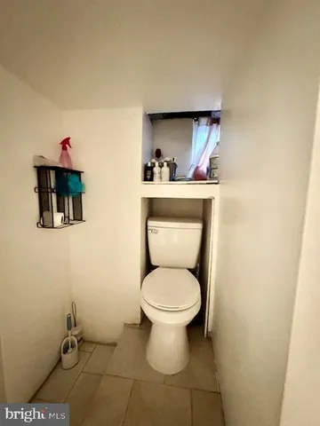 a bathroom with a toilet and a sink