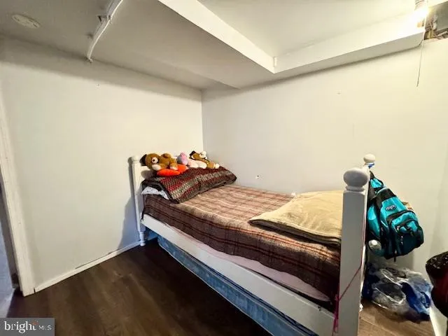 a bedroom with bed and a closet