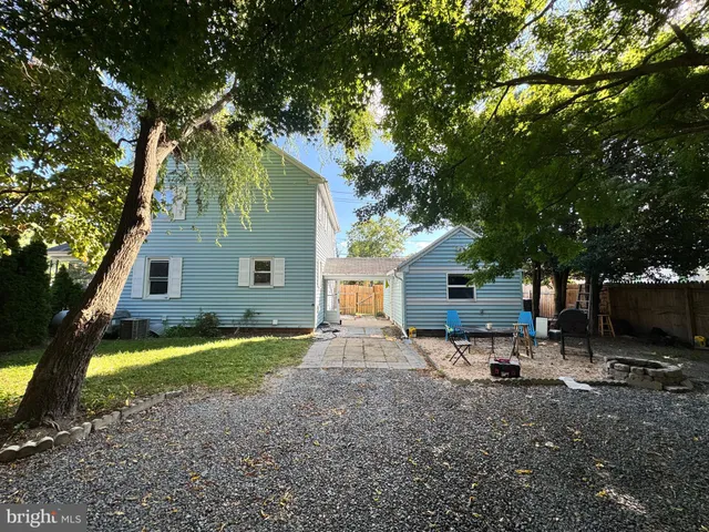 a house view with a sitting space and garden