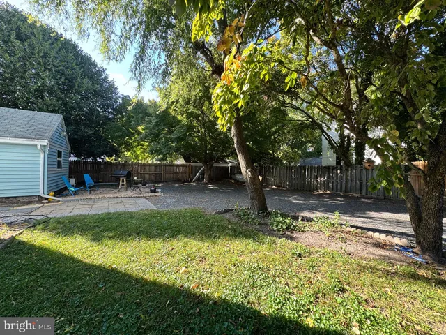 a view of a yard with swimming pool
