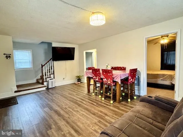 a view of a livingroom with furniture and a flat screen tv