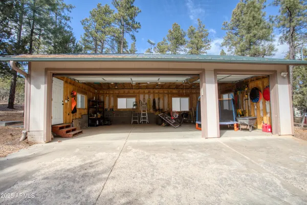 a view of house with outdoor space and sitting area