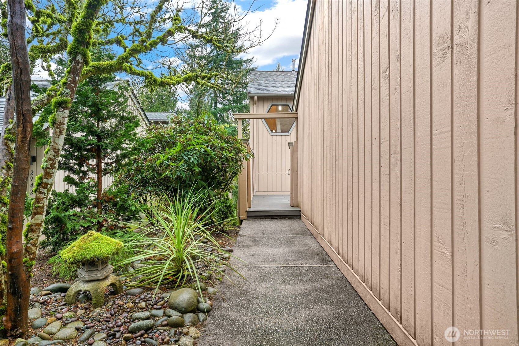 2940 Kennewick Place Northeast Renton, WA 98056 - Photo 2 of 37 a view of a pathway with a plants