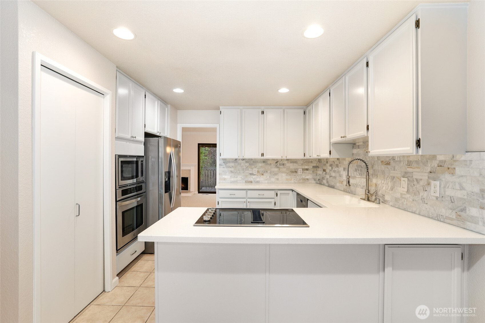 2940 Kennewick Place Northeast Renton, WA 98056 - Photo 9 of 37 a kitchen with a sink a refrigerator and a sink