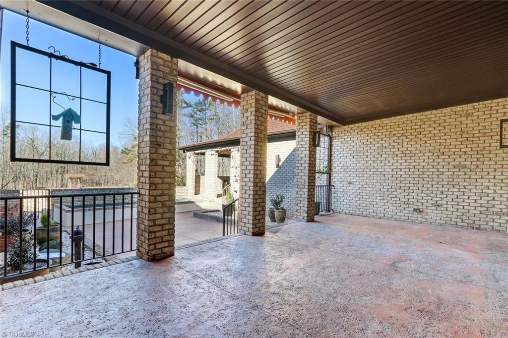 5552 Drake Road Greensboro, NC 27406 - Photo 23 of 29 the back covered terrace, walk right out of the living room to this