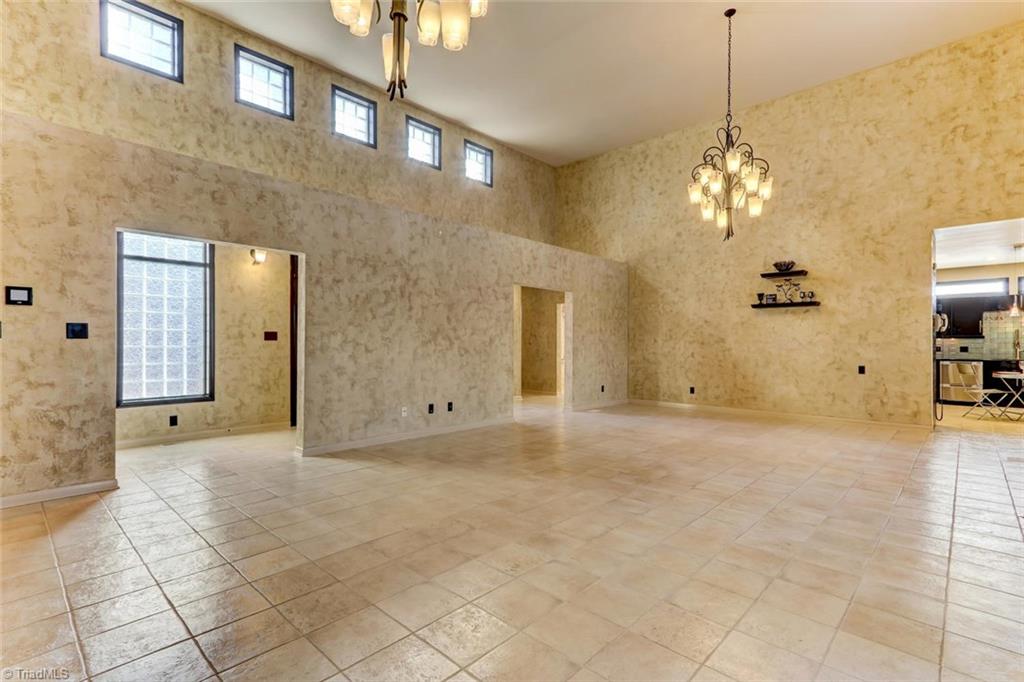 5552 Drake Road Greensboro, NC 27406 - Photo 5 of 29 the living room facing the foyer and the kitchen in the back right.
