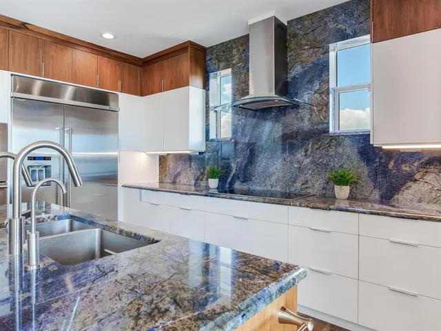 a view of a hallway and a livingroom with furniture