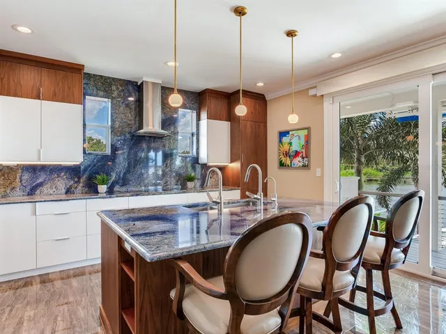 a view of a livingroom with wooden floor and chair