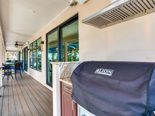 a view of a lake with a table and chairs