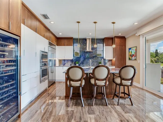 a view of a lake with houses in the back