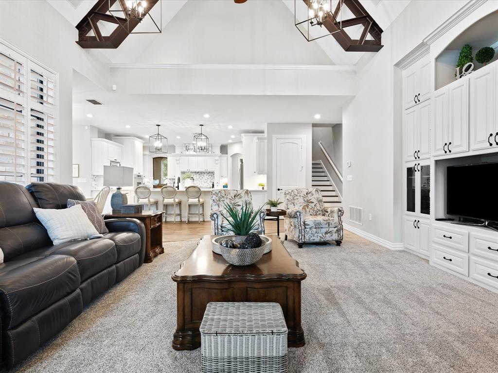 8970 Burnett Road Justin, TX 76247 - Photo 10 of 40 a living room with furniture a flat screen tv and a window