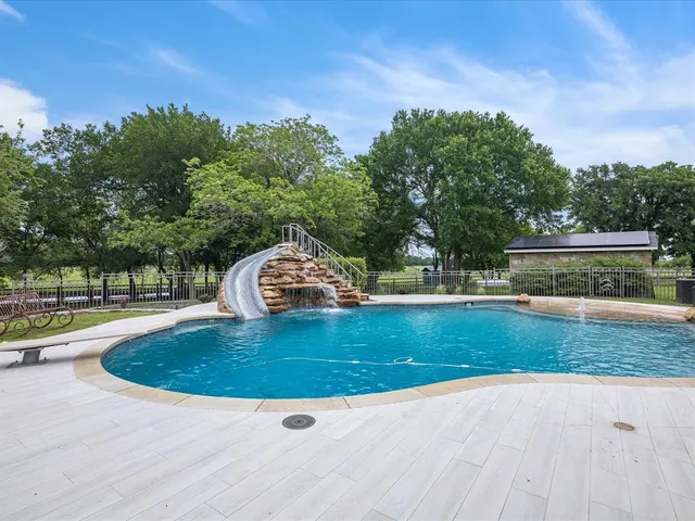 a view of outdoor space with swimming pool