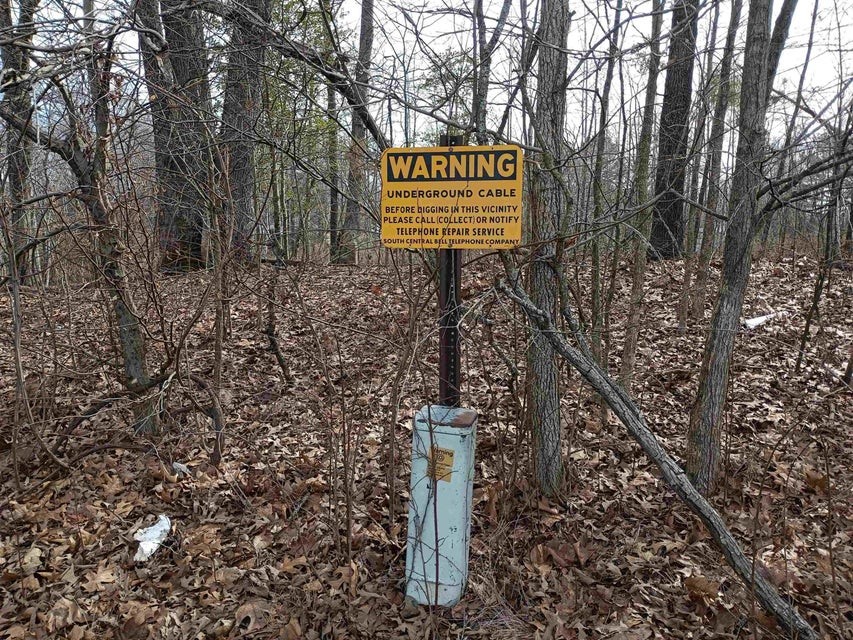 0 Highway 18 Medon, TN 38356 - Photo 3 of 9 a sign board with tall trees