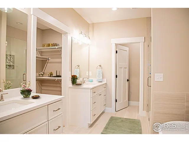 a bathroom with a sink a mirror and a window