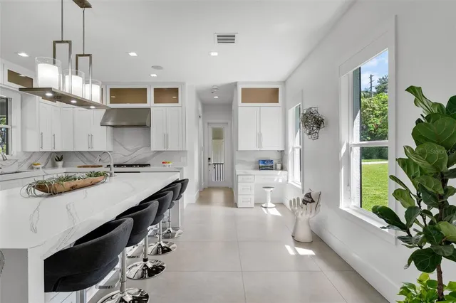a bathroom with a double vanity sink mirror and shower