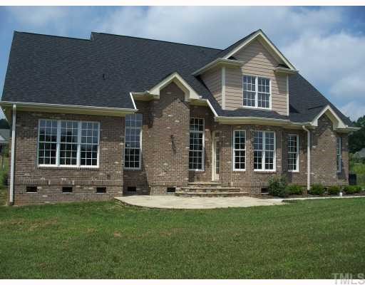 65 North Old Lantern Road Timberlake, NC 27583 - Photo 2 of 12 front view of a house with a yard