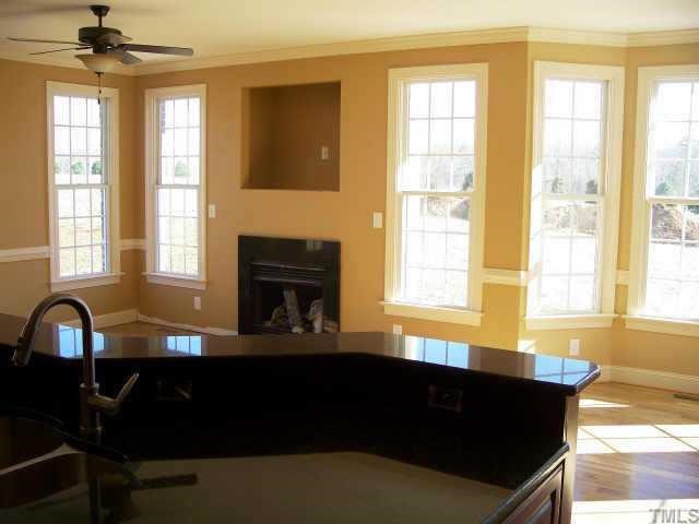 65 North Old Lantern Road Timberlake, NC 27583 - Photo 8 of 12 a living room with furniture and a fireplace
