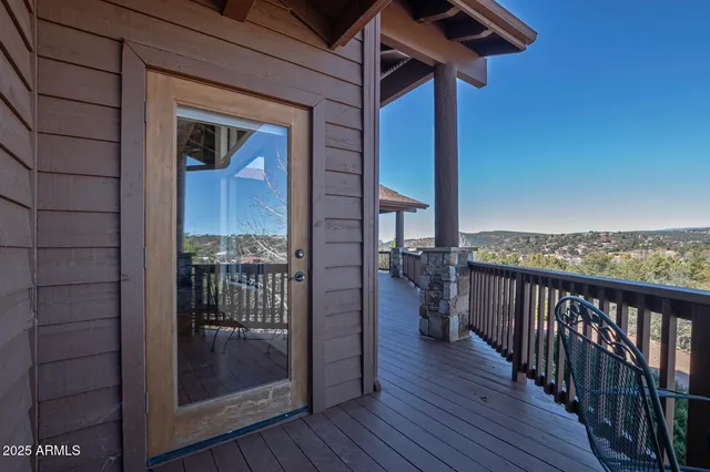 a view of a balcony with chairs