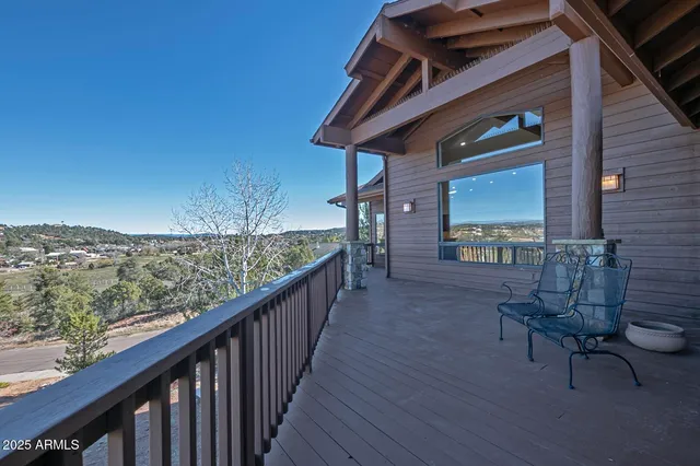 a view of a door and chair in the balcony