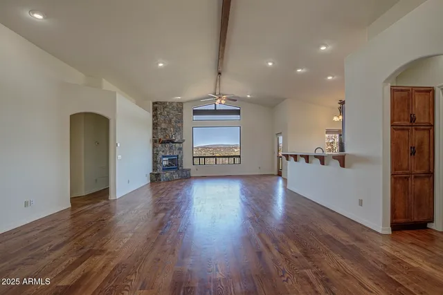 a view of a kitchen with a sink and a refrigerator