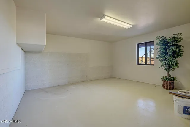 a view of a house with a tree and a yard