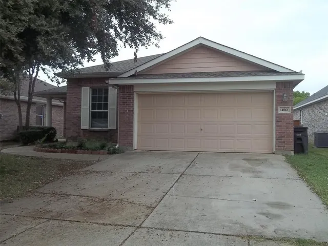a front view of a house with garage