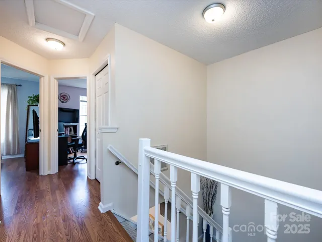 a bedroom with a bed and a night stand