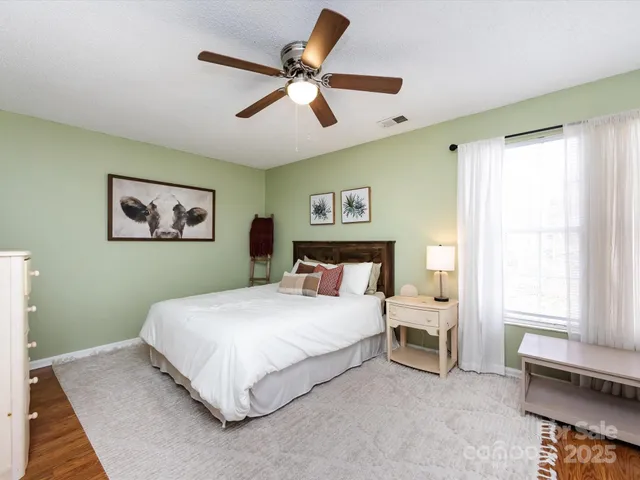 a bedroom with a large bed and furniture