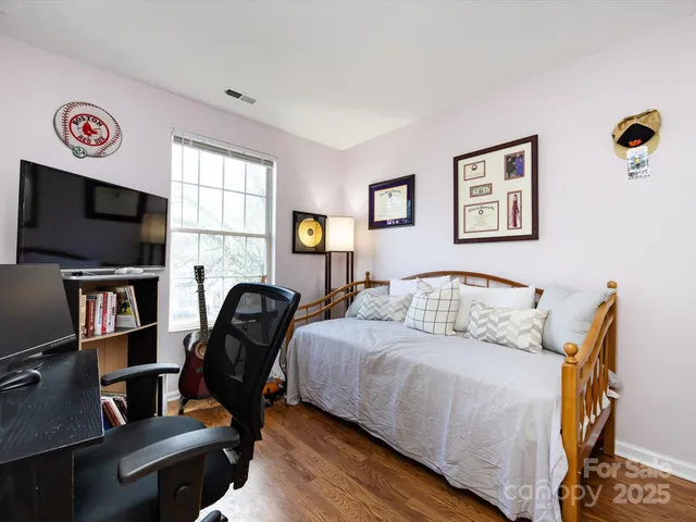 a view of a chairs and table in the back yard of the house