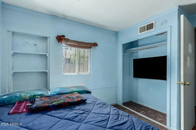a bedroom with furniture and a fireplace