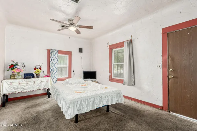 a bed room with a bed and a window